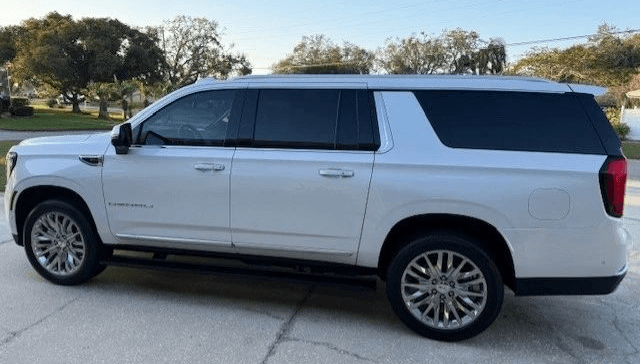 Staff assisting passengers with their bags during an airport transfer.